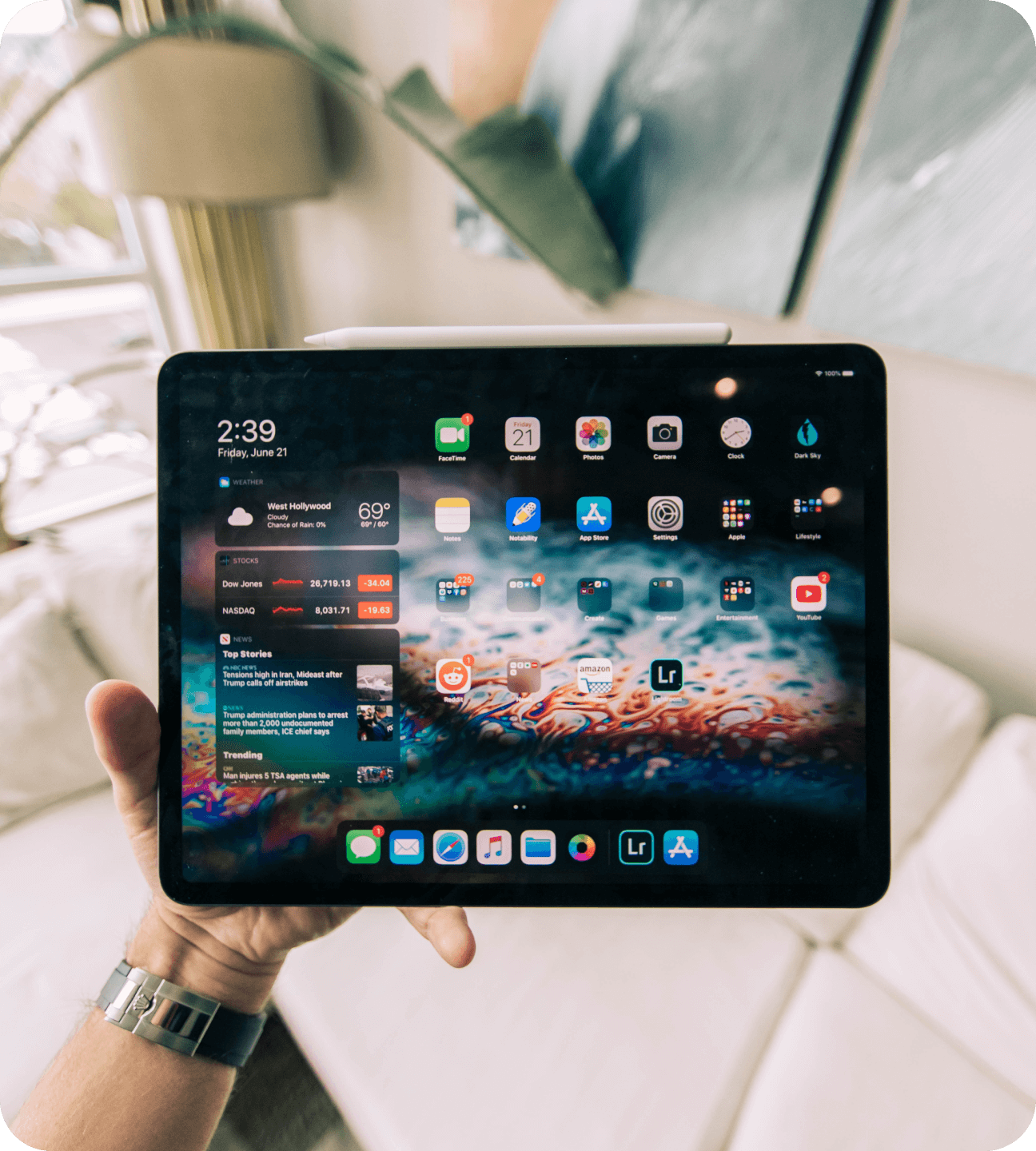 An image of a person holding an iPad