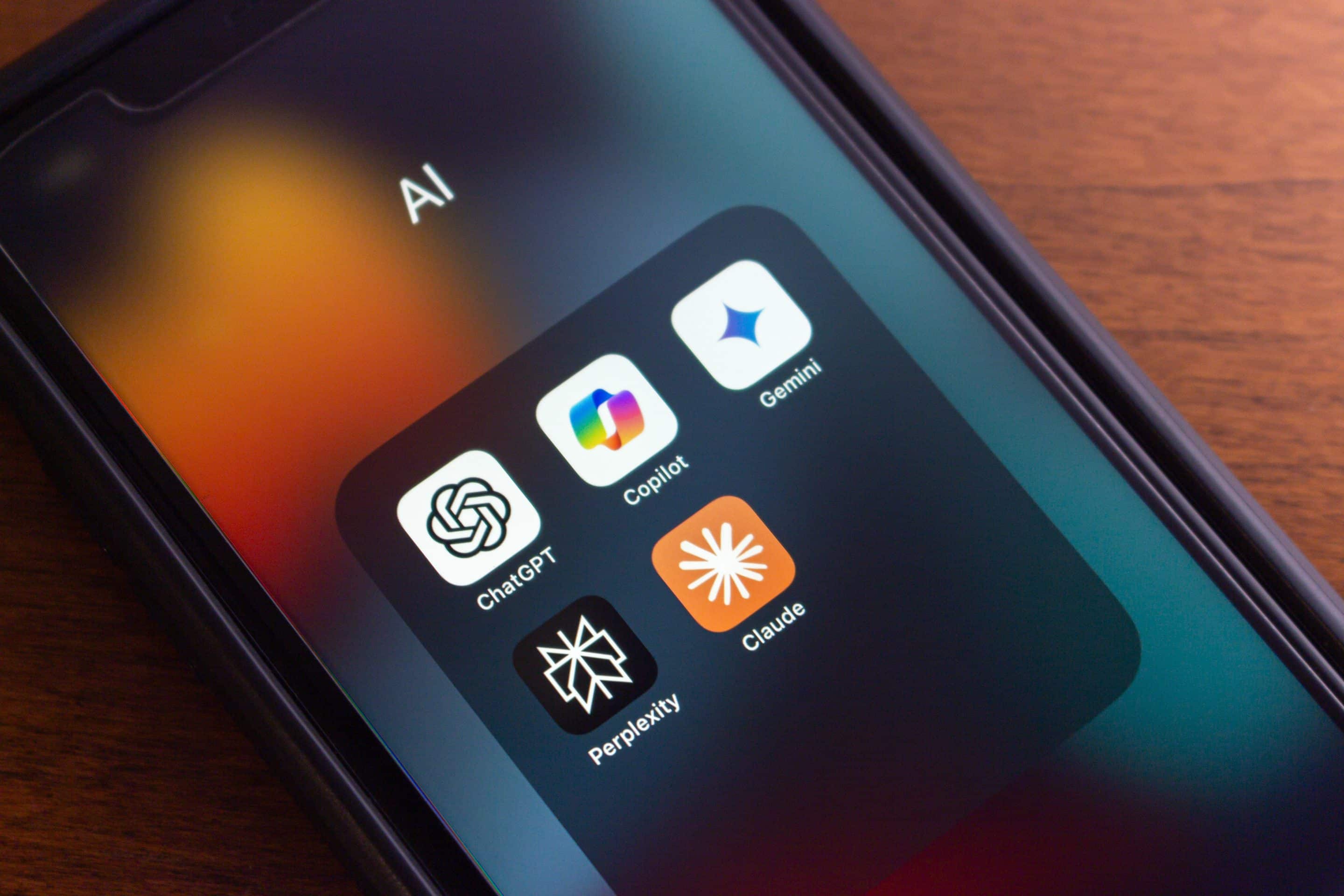Vancouver, CANADA - Jul 15 2024 : ChatGPT, Microsoft Copilot, Google Gemini, Perplexity and Claude icons seen on an iPhone. Leading Artificial Intelligence, Generative AI Chatbot Concept