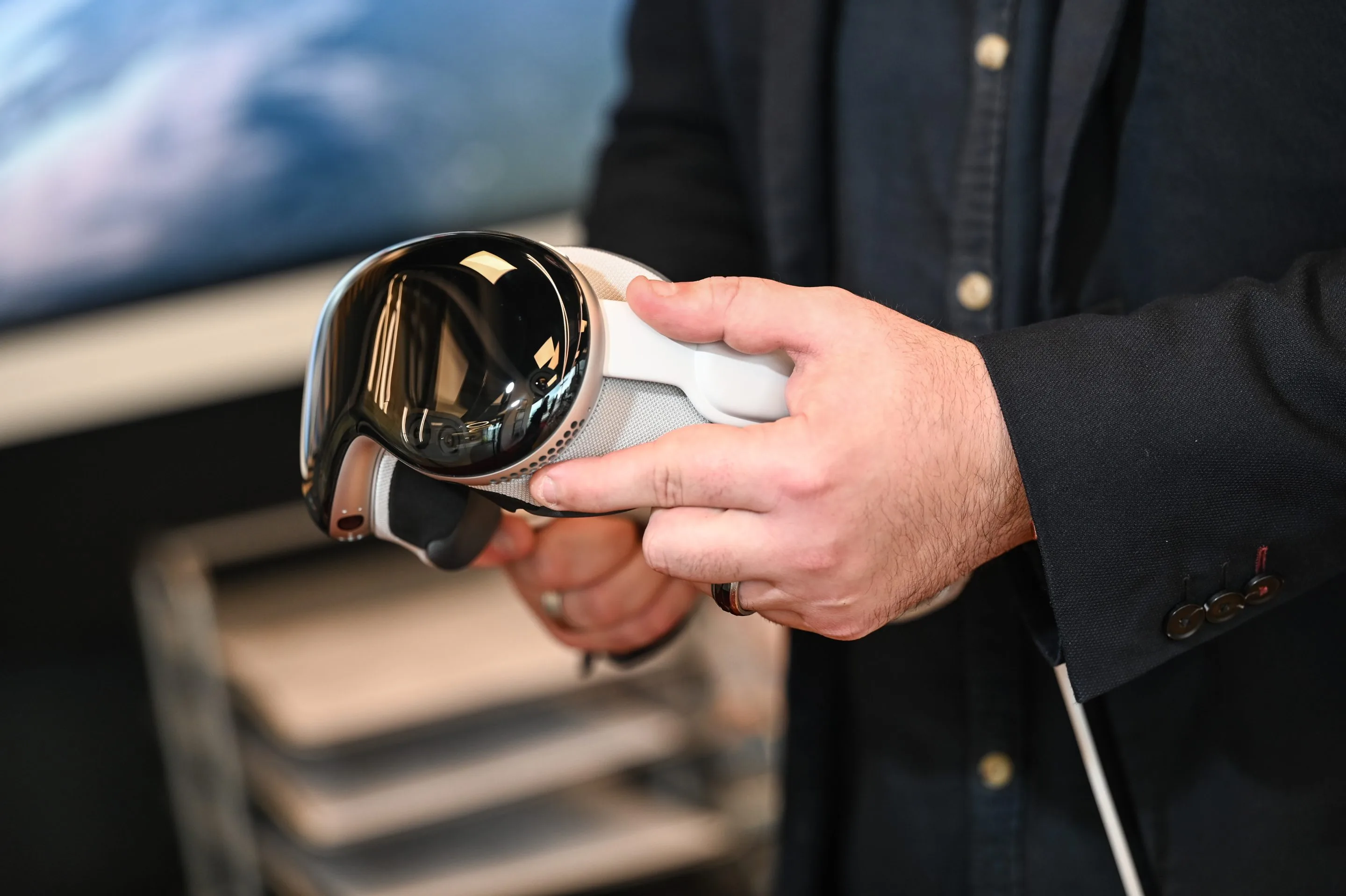man holding an apple vision pro