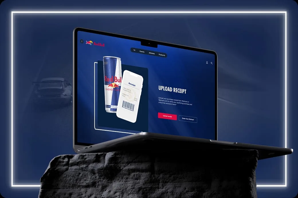 Laptop mockup showing Red Bull's Upload Receipt page with a can, a barcode receipt and an Order from Walmart button