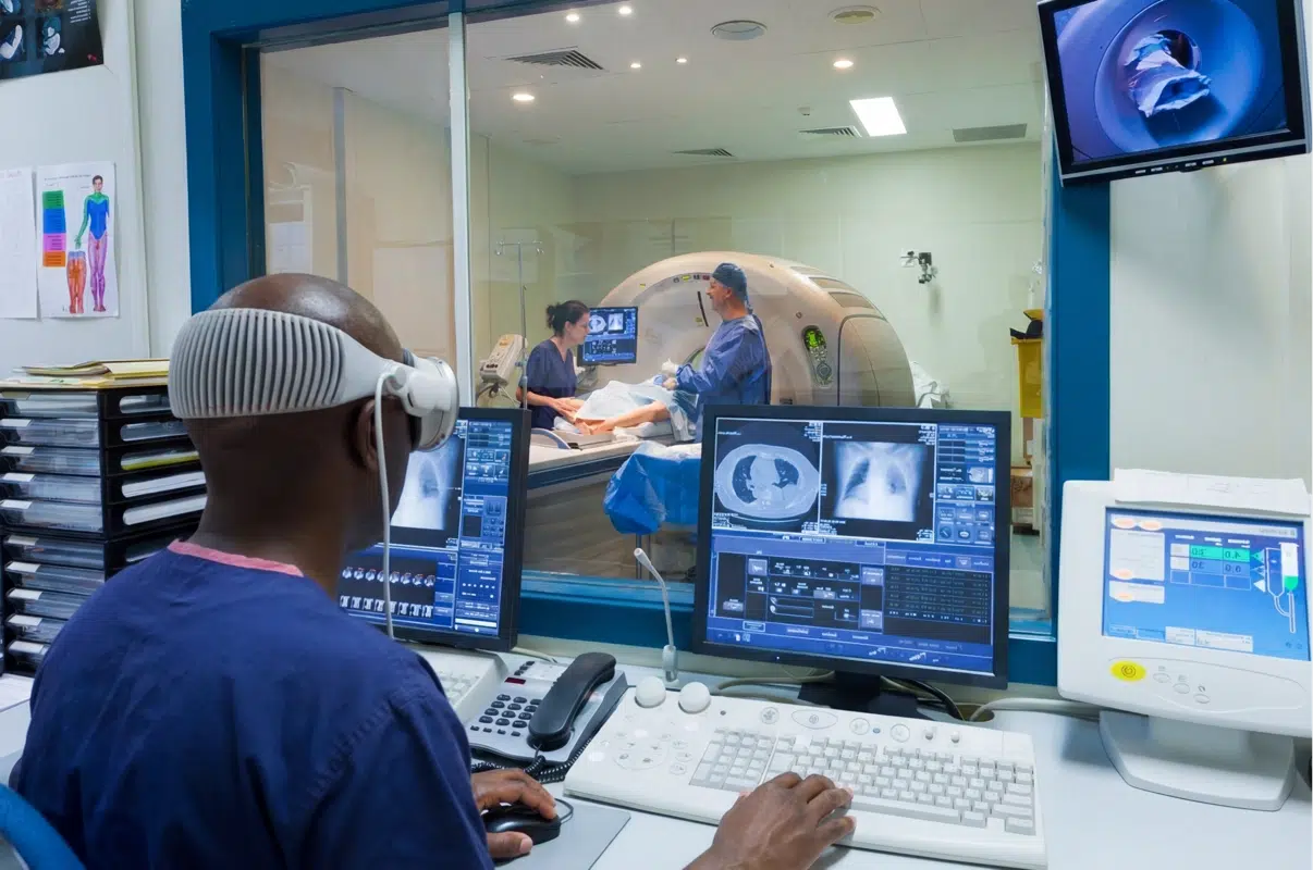a man wearing a vision pro to assist with an MRI machine