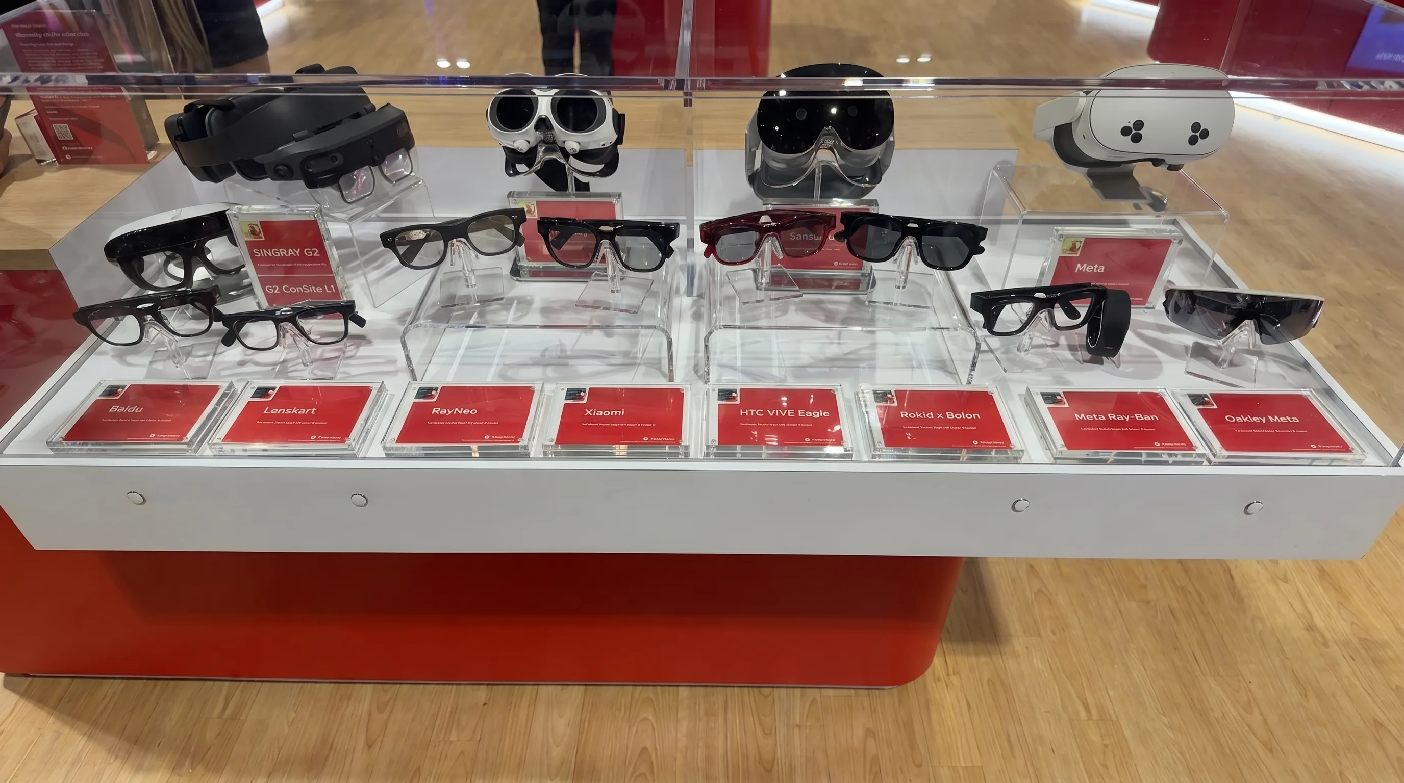 Smart glasses and XR devices displayed at AWE 2026 in Long Beach, including Meta Ray-Ban, Oakley Meta, Rokid, HTC Vive Eagle, Xiaomi, RayNeo, LensKart, Baidu, and Snap AR glasses competitors.