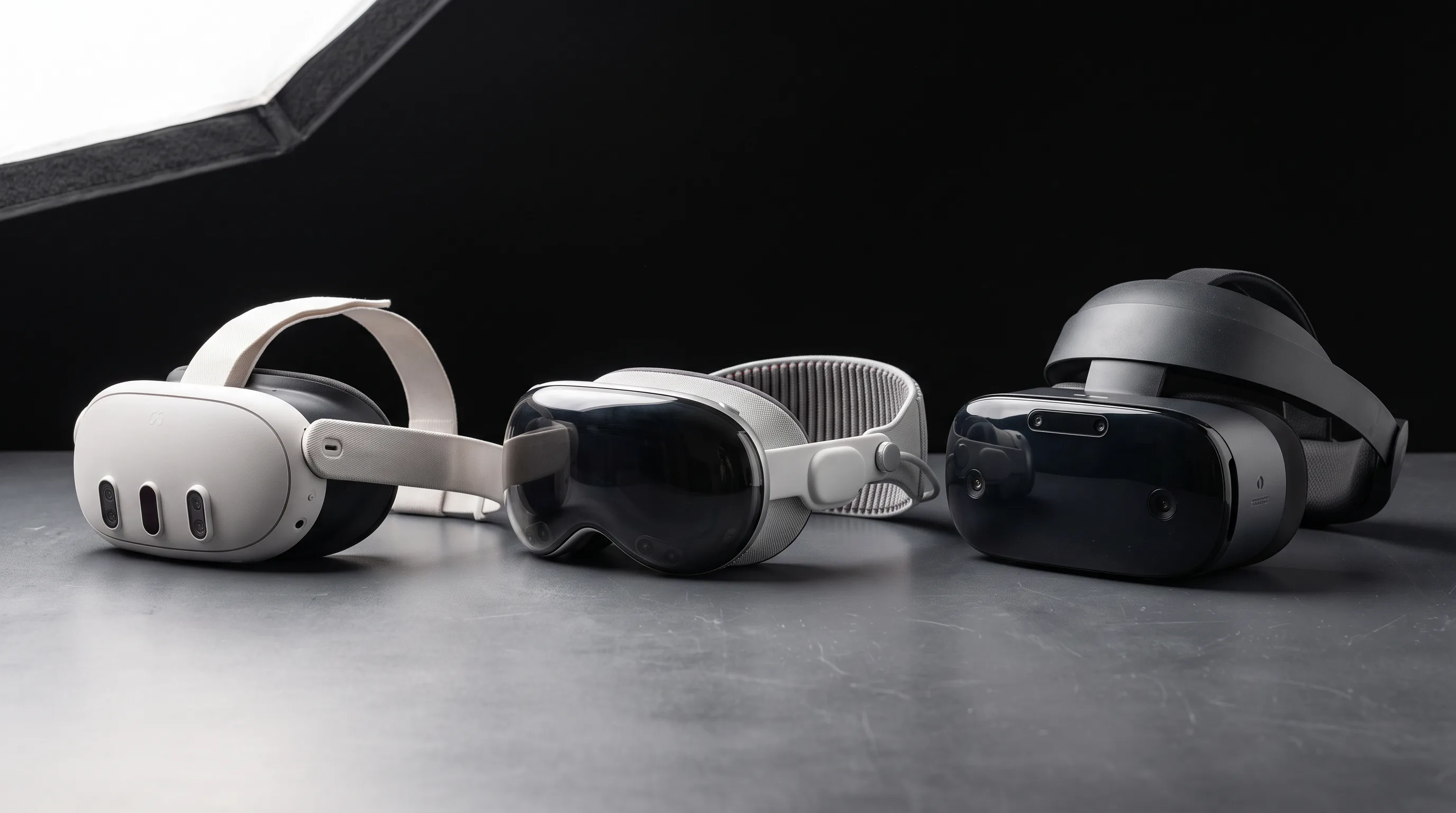 Meta Quest 3, Apple Vision Pro, and Samsung Galaxy XR headsets side by side