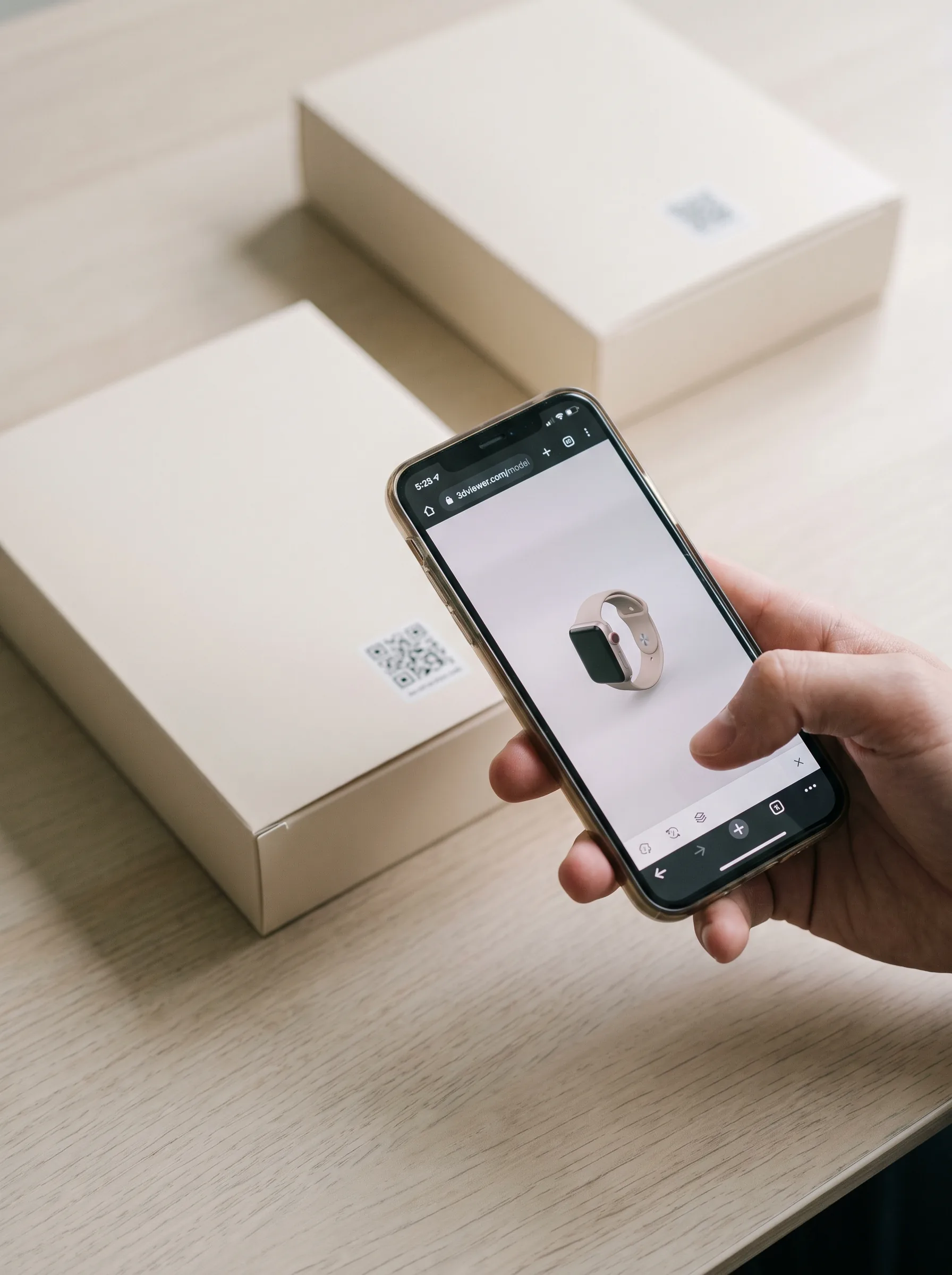 Phone scanning a QR code on product packaging to launch a browser-based AR experience