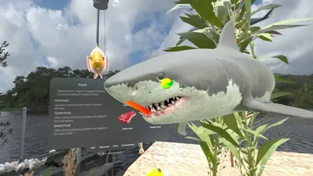 Virtual great white shark beside the species panel on a lakeside deck