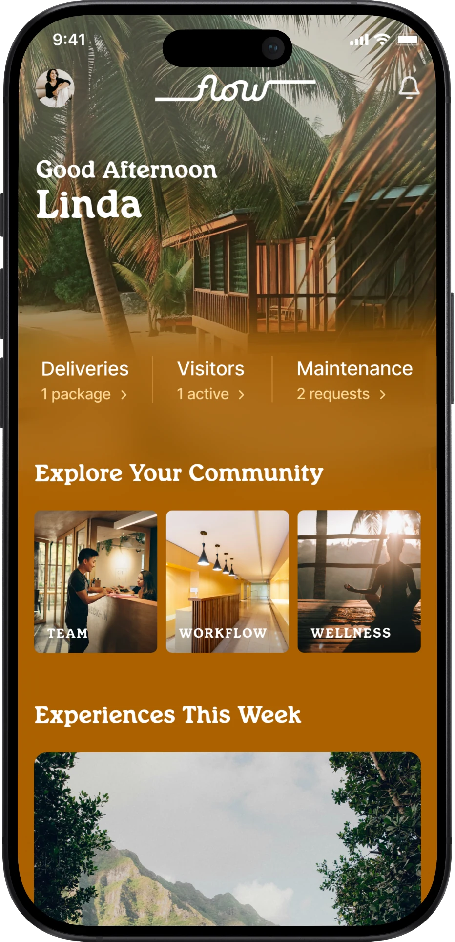 Flow Life home screen on iPhone: Good Afternoon Linda, with Deliveries, Visitors and Maintenance shortcuts and Explore Your Community cards for Team, Workflow and Wellness