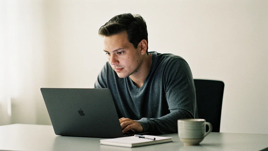 A project manager reviewing a software development cost estimate at a clean office desk