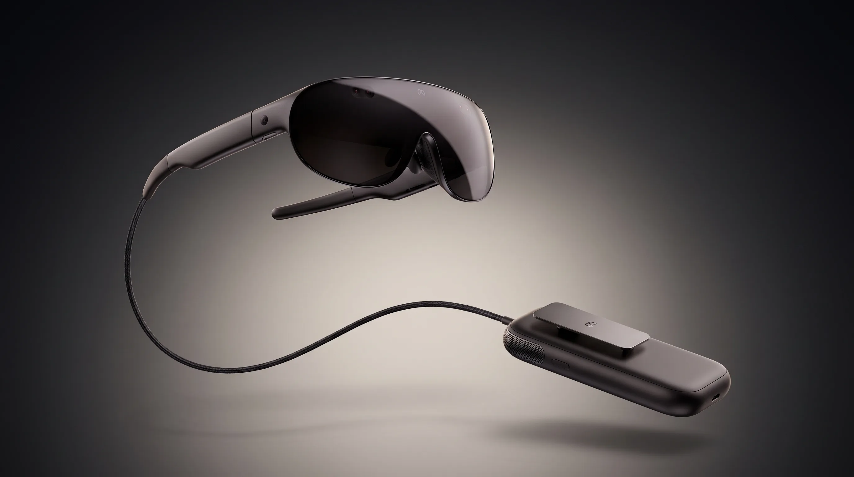 Meta VR Glasses with their dark wraparound visor floating above the tethered compute puck on a charcoal studio gradient